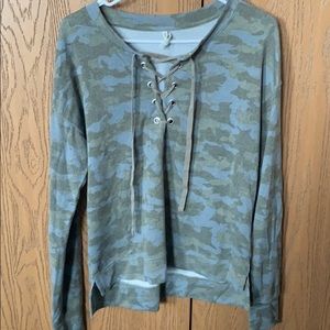 Camo top with open tie at upper chest